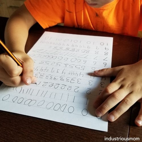 Tracing numbers 0 to 10 by a child