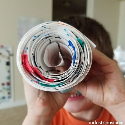 Boy holding The number Roll made at home